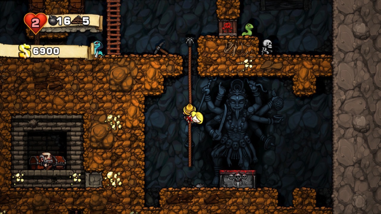 Spelunky: спелеолог в жёлтом шлеме висит на верёвке рядом с тёмной многорукой статуей Кали и алтарём с черепами; вверху змея и скелет, слева вверху счётчики жизней, бомб, верёвок и денег